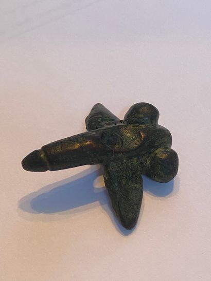 Antique pendant representing a winged phallus...