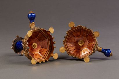 Pair of hand candlesticks in vermeil and...