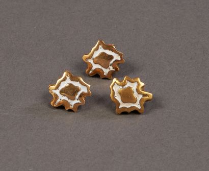 Three buttons by Line VAUTRIN in white enamelled...