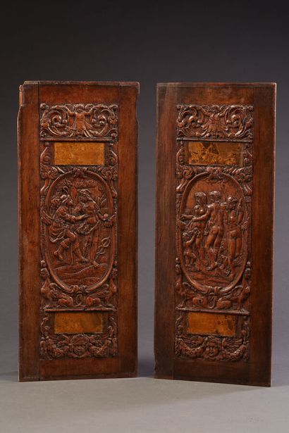 Two carved walnut panels representing in...