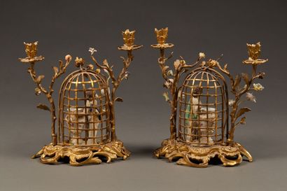 Pair of candelabras in chased and gilded...