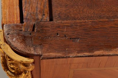 Rosewood chest of drawers with a slight central...