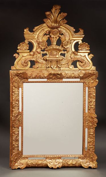 Gilded and carved wood pediment window decorated...