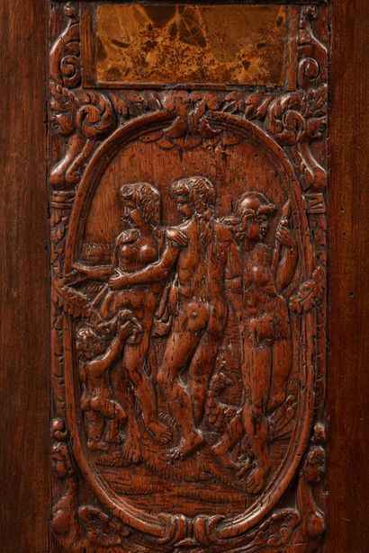 Two carved walnut panels representing in...