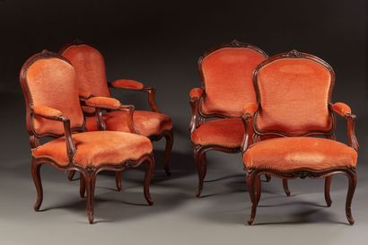 Suite of eight armchairs in molded and carved...