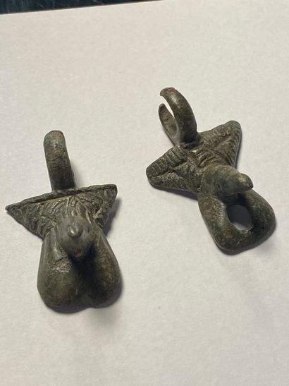 Two antique pendants representing a phallus,...