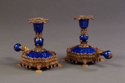 Pair of hand candlesticks in vermeil and...