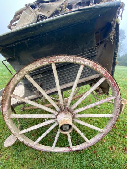 Carriage on horseback. Hub inscribed 