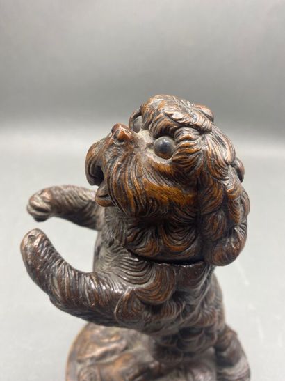Carved wooden dog, head forming a lid.
Work...