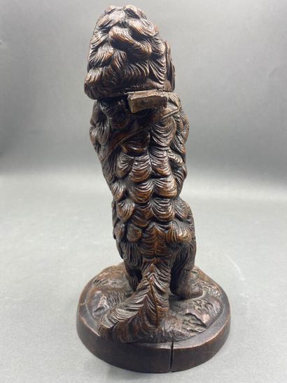 Carved wooden dog, head forming a lid.
Work...