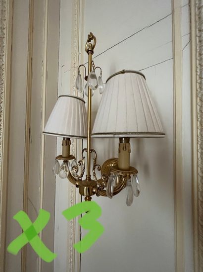 Three sconces with two arms of light with...