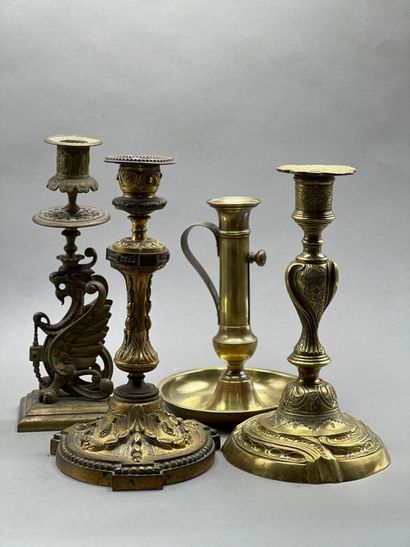Set of four candlesticks in gilded metal...