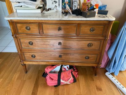 
Natural wood chest of drawers opening to...