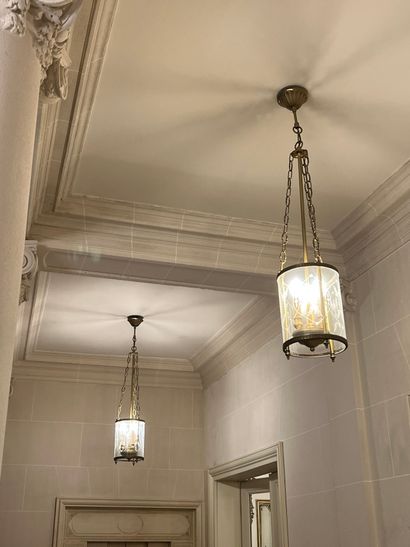 Three cylindrical brass lanterns

Louis XVI...