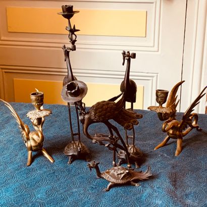 Set of five bronze candlesticks representing...