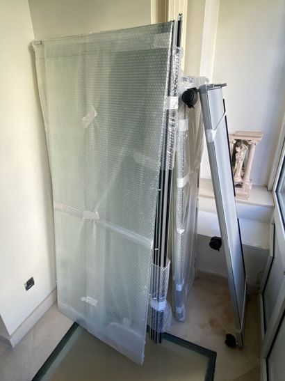 Glass display case with shelves, on whee...