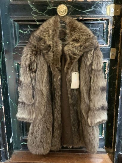 Three coats in various furs of which one...