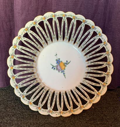Basket with fruits in openwork earthenware....