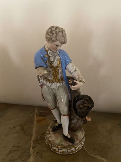 Three statuettes in painted porcelain (two...