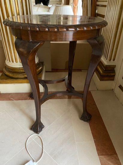 
Wooden pedestal table with four legs joined...