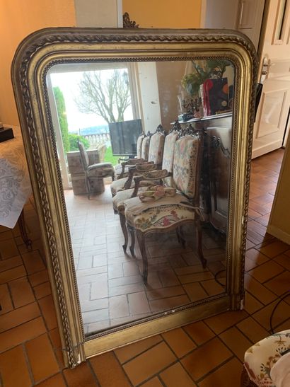 Gilded stucco mantelpiece decorated with...