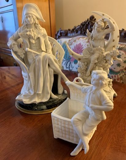 Three bisque statuettes representing a child...