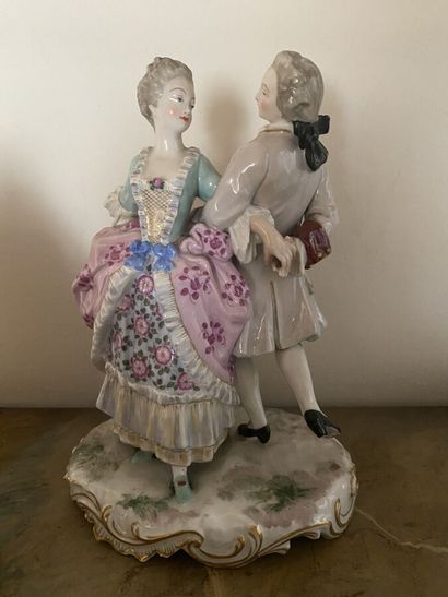 Three statuettes in painted porcelain (two...