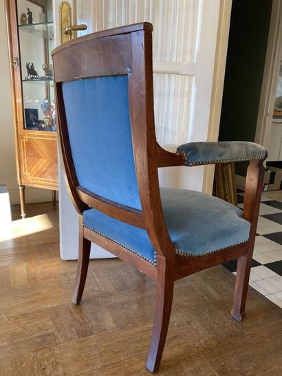 Natural wood armchair upholstered with blue...