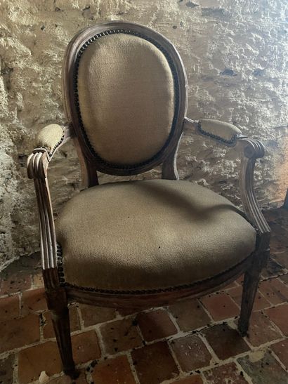 Cabriolet armchair in molded and carved natural...
