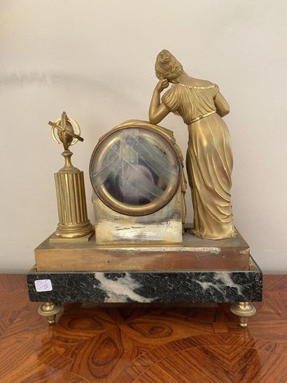 Clock in gilt bronze and chased featuring...