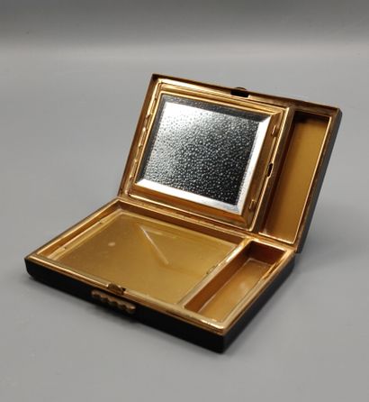 Black lacquered metal poudrier.