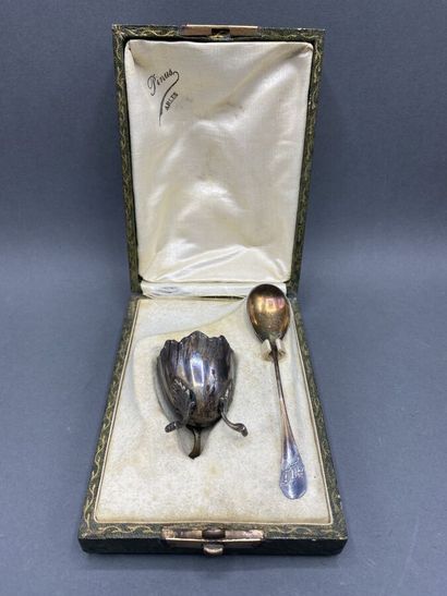 Silver egg cup and its spoon

End of the...