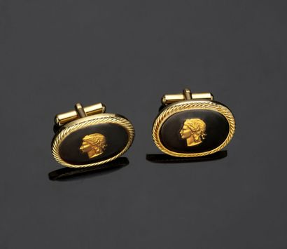 Pair of oval gilt metal cufflinks decorated...
