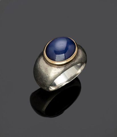 Silver ring set with a blue stone cabochon.

Gross...