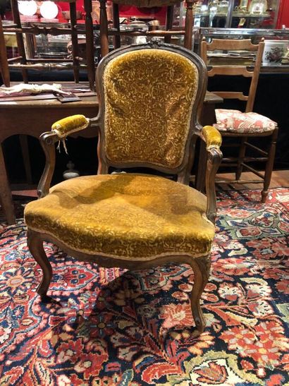 Three cabriolet armchairs in molded and carved...