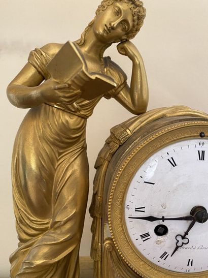 Clock in gilt bronze and chased featuring...