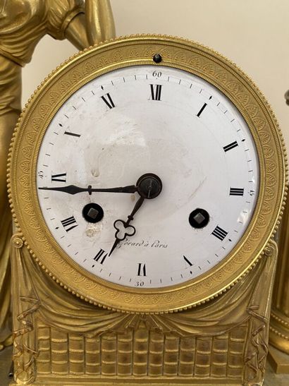Clock in gilt bronze and chased featuring...
