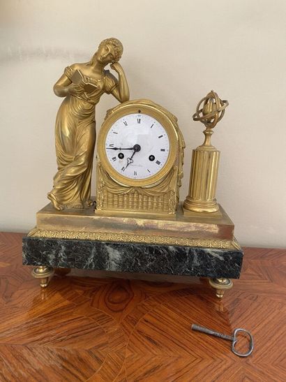 Clock in gilt bronze and chased featuring...
