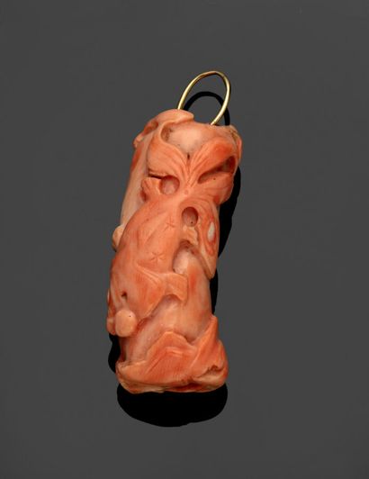 Coral pendant with relief decoration of fish.

Length...