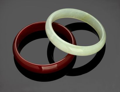 Two bracelets, one in jade.