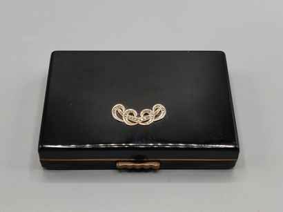 Black lacquered metal poudrier.
