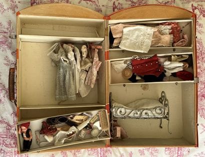 Miniature trunk containing clothes and various...