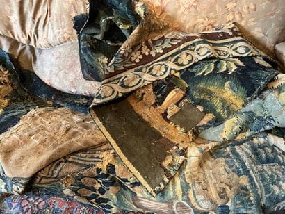 Two pieces of tapestry decorated with characters...