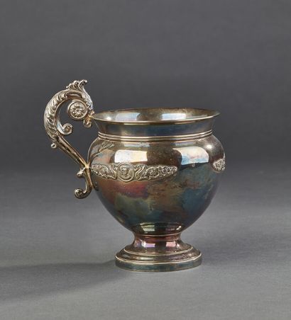 Silver plated cup with a handle decorated...