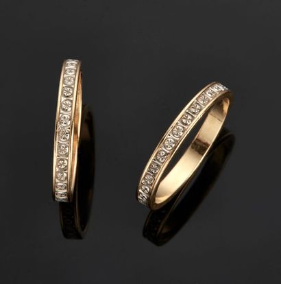 Two wedding rings in yellow and white gold...