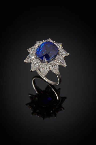 Platinum ring set with a cushion-shaped sapphire...