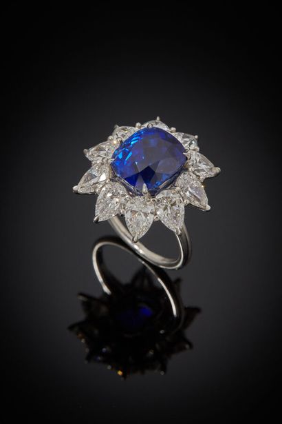 Platinum ring set with a cushion-shaped sapphire...