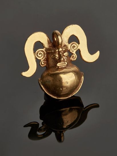 Metal pendant representing a stylized character,...