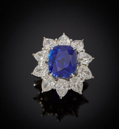 Platinum ring set with a cushion-shaped sapphire...