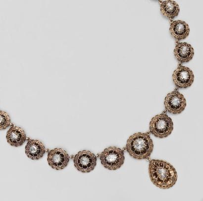 Collier en or jaune articulé de rosaces en...